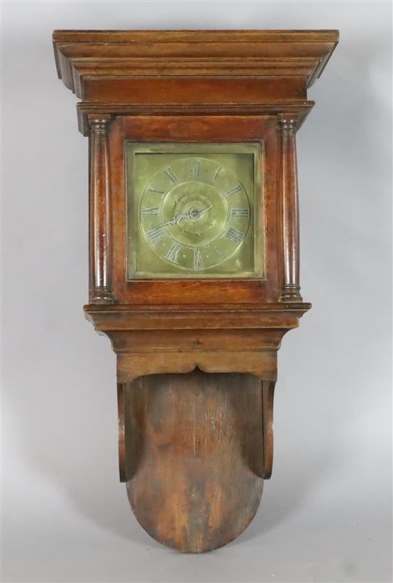 An early 19th century oak cased wall timepiece with alarum, height 31in.